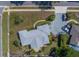 Aerial view of the property showing the roof, driveway, and landscaping at 501 Poinsettia Rd, Belleair, FL 33756