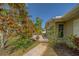 A paved walkway leads to a cozy patio, perfect for outdoor relaxation and entertaining at 501 Poinsettia Rd, Belleair, FL 33756