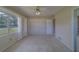 Bedroom with built in shelves, carpet and ensuite bathroom at 501 Poinsettia Rd, Belleair, FL 33756