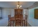 Formal dining room features a wooden table set and a classic china cabinet at 501 Poinsettia Rd, Belleair, FL 33756