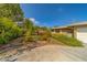 Paver walkway with lush landscaping leading up to the home at 501 Poinsettia Rd, Belleair, FL 33756