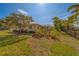 Well-maintained single-story home featuring lush landscaping and classic design at 501 Poinsettia Rd, Belleair, FL 33756