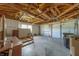 Spacious two car garage featuring exposed wood beams, ample storage and garage door openers at 501 Poinsettia Rd, Belleair, FL 33756