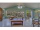 Bright living area with a vaulted ceiling, plenty of windows and tile flooring at 501 Poinsettia Rd, Belleair, FL 33756