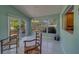 Sunroom with tile flooring, windows viewing the exterior, and seating at 501 Poinsettia Rd, Belleair, FL 33756