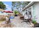 Spacious backyard patio with comfortable seating, mature trees, and a relaxing ambiance at 504 Cleveland Ave, Largo, FL 33770