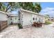 Charming backyard with brick pavers, seating area, and well-maintained landscaping at 504 Cleveland Ave, Largo, FL 33770