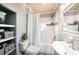 Nicely decorated bathroom with a shower-tub combination and storage shelves at 504 Cleveland Ave, Largo, FL 33770