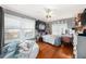 Comfortable bedroom with hardwood floors, lots of light, ceiling fan and cozy bean bag at 504 Cleveland Ave, Largo, FL 33770