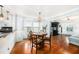Bright dining room with hardwood floors, a round table, and a view of the living room at 504 Cleveland Ave, Largo, FL 33770