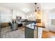 Modern kitchen featuring stainless steel appliances, granite countertops, and stylish cabinetry at 504 Cleveland Ave, Largo, FL 33770