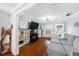 Well-lit living room with a fireplace, built-in shelving, hardwood floors, and a comfortable sofa at 504 Cleveland Ave, Largo, FL 33770