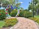 Beautiful view of an art sculpture in Largo Central Park, enhanced by colorful flowerbeds and greenery at 504 Cleveland Ave, Largo, FL 33770