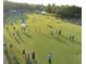 Aerial shot of a large open lawn at Largo Central Park filled with people enjoying a sunny day at 504 Cleveland Ave, Largo, FL 33770