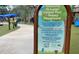 Informative sign detailing the rules and hours of operation for the Rotary Playground in Largo Central Park at 504 Cleveland Ave, Largo, FL 33770