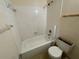 Functional bathroom with tile shower and tub, offering essential amenities for renovation at 5124 Chilkoot St, Tampa, FL 33617
