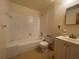 Functional bathroom with a tub-shower combination and a vanity, ready for renovation at 5124 Chilkoot St, Tampa, FL 33617