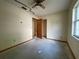 Bedroom with a ceiling fan, closet, and natural light from the window offering a cozy feel at 5124 Chilkoot St, Tampa, FL 33617