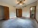Bedroom with ceiling fan, closet, and access to bathroom, offering renovation opportunity at 5124 Chilkoot St, Tampa, FL 33617