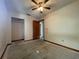 A bedroom featuring a closet and access to bathroom, offering renovation potential at 5124 Chilkoot St, Tampa, FL 33617
