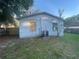 Exterior backyard showing an air conditioning unit, a covered window, and the fence line at 5124 Chilkoot St, Tampa, FL 33617