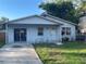 Charming single-story home with a simple landscape and a concrete driveway at 5124 Chilkoot St, Tampa, FL 33617