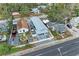 Overhead aerial of new construction home with a large backyard patio with furniture at 613 6Th E Ave, Bradenton, FL 34208