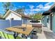Enclosed backyard patio with a barbecue and a covered hot tub at 613 6Th E Ave, Bradenton, FL 34208