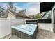 Backyard patio with a refreshing hot tub, offering a serene relaxation space at 613 6Th E Ave, Bradenton, FL 34208
