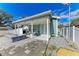 Inviting outdoor space with a stone fire pit, comfortable seating, and a well-maintained patio area for entertaining at 613 6Th E Ave, Bradenton, FL 34208