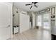 This contemporary bedroom features a murphy bed, ample natural light, and wood flooring at 613 6Th E Ave, Bradenton, FL 34208