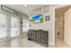 Well-lit flex room with chic design, offering a multi-functional space with easy access to a bath and patio at 613 6Th E Ave, Bradenton, FL 34208