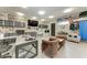 Spacious garage converted to a bonus room with custom storage, desk, and a seating area at 613 6Th E Ave, Bradenton, FL 34208