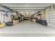 Expansive garage with custom storage, a seating area, and workspace for hobbies and projects at 613 6Th E Ave, Bradenton, FL 34208