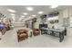 Spacious garage with epoxy floors, storage, overhead lighting, and office space at 613 6Th E Ave, Bradenton, FL 34208