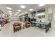 Spacious garage with epoxy floors, storage, overhead lighting, and office space at 613 6Th E Ave, Bradenton, FL 34208