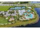 Aerial view of community amenities including tennis, basketball courts, pool, and playground, offering a diverse range of activities at 6227 Golden Nettle Dr, Apollo Beach, FL 33572