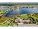 Aerial shot capturing a serene lake, playground, and lush green spaces, showcasing the community's natural beauty at 6227 Golden Nettle Dr, Apollo Beach, FL 33572