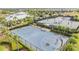 Aerial view of the community basketball court adjacent to tennis courts and a picnic area at 6227 Golden Nettle Dr, Apollo Beach, FL 33572