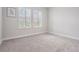 Bright bedroom with plush carpeting and plantation shutters at 6227 Golden Nettle Dr, Apollo Beach, FL 33572