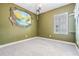 Empty bedroom features unique textured wall art and a neutral carpet at 6227 Golden Nettle Dr, Apollo Beach, FL 33572