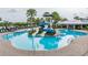 A large community pool with winding water slides and luxurious lounge chairs for residents at 6227 Golden Nettle Dr, Apollo Beach, FL 33572