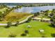 Aerial view of the community dog park with play structures, offering a safe and fun environment for pets and owners at 6227 Golden Nettle Dr, Apollo Beach, FL 33572