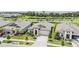 Aerial view of home showcasing manicured landscaping and pristine lawn at 6227 Golden Nettle Dr, Apollo Beach, FL 33572