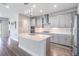 Well-designed kitchen featuring gray cabinetry, island, and stainless steel appliances at 6227 Golden Nettle Dr, Apollo Beach, FL 33572