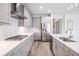 Bright kitchen features stainless steel appliances, gas range, and white backsplash at 6227 Golden Nettle Dr, Apollo Beach, FL 33572