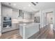 Modern kitchen featuring gray cabinets, stainless appliances, and center island at 6227 Golden Nettle Dr, Apollo Beach, FL 33572