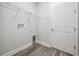 Laundry room with vinyl floors, shelving and hookups at 6227 Golden Nettle Dr, Apollo Beach, FL 33572