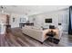 Bright living room with modern hardwood flooring, neutral tones, and lots of natural light at 6227 Golden Nettle Dr, Apollo Beach, FL 33572