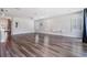 Spacious living room with hardwood floors, plantation shutters, and modern lighting at 6227 Golden Nettle Dr, Apollo Beach, FL 33572